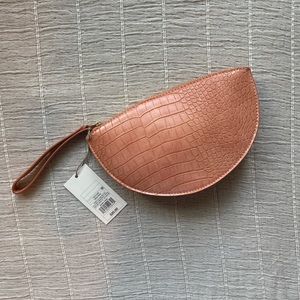 A new day peach alligator clutch